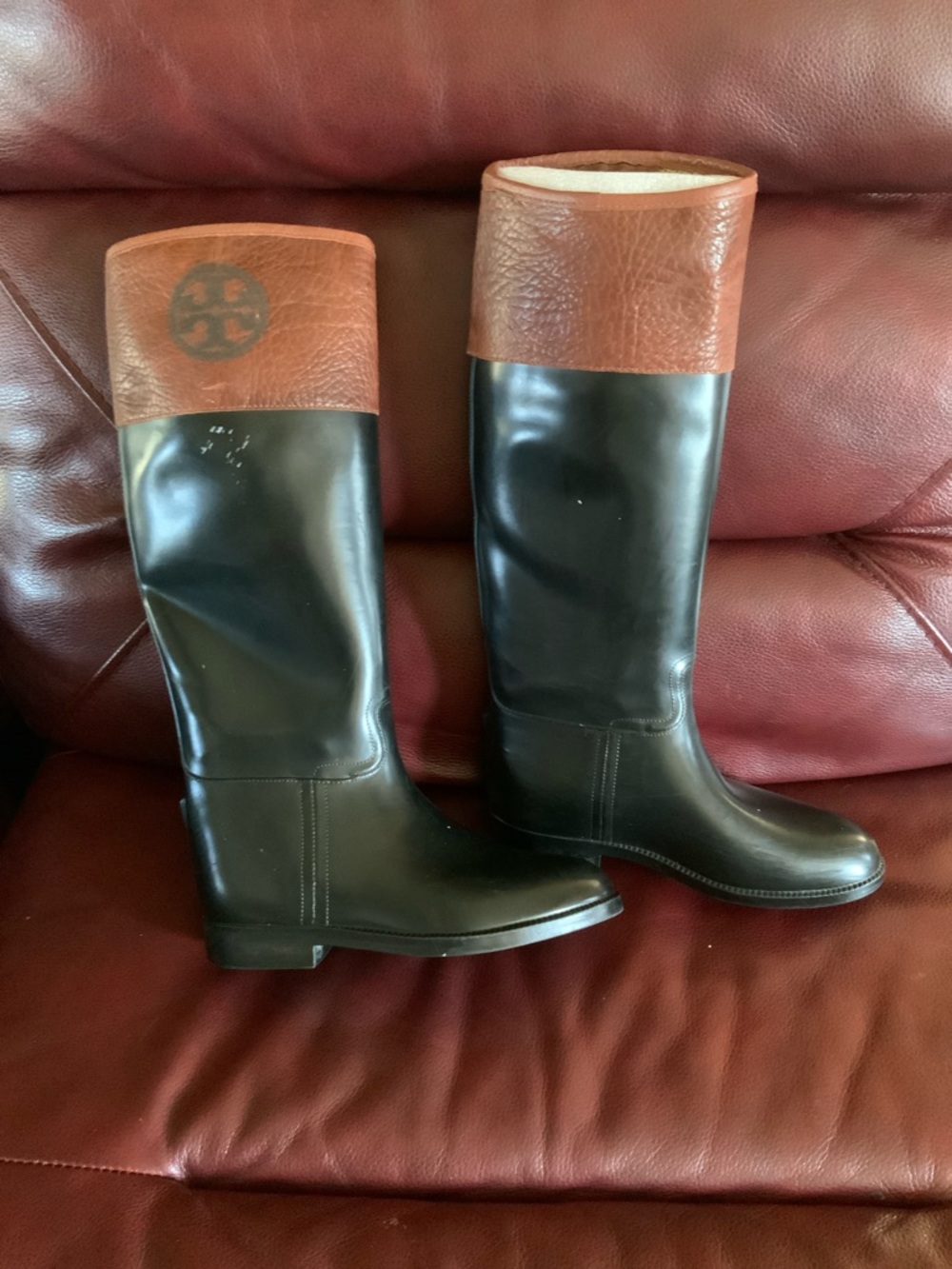 Tory Burch/Aigle rubber  Black and Brown Boots. Minor stains present. Sz. 7B.
